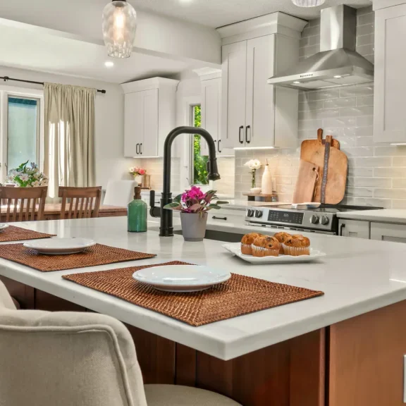 Bright Pittsfield kitchen with white cabinetry, a rift-sawn white oak island, and quartz countertops.